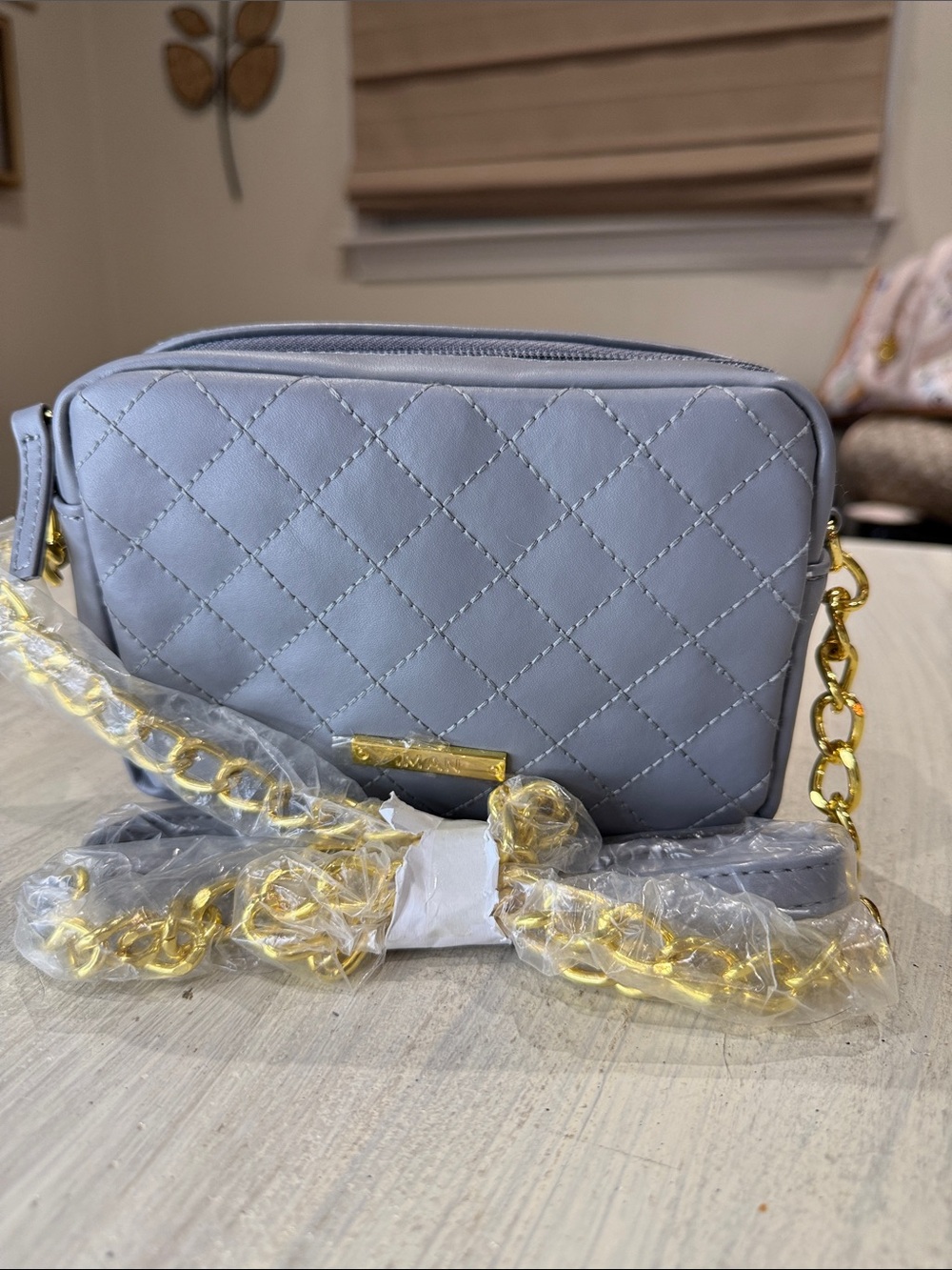 IMAN Quilted Light Gray Crossbody with Gold Chain